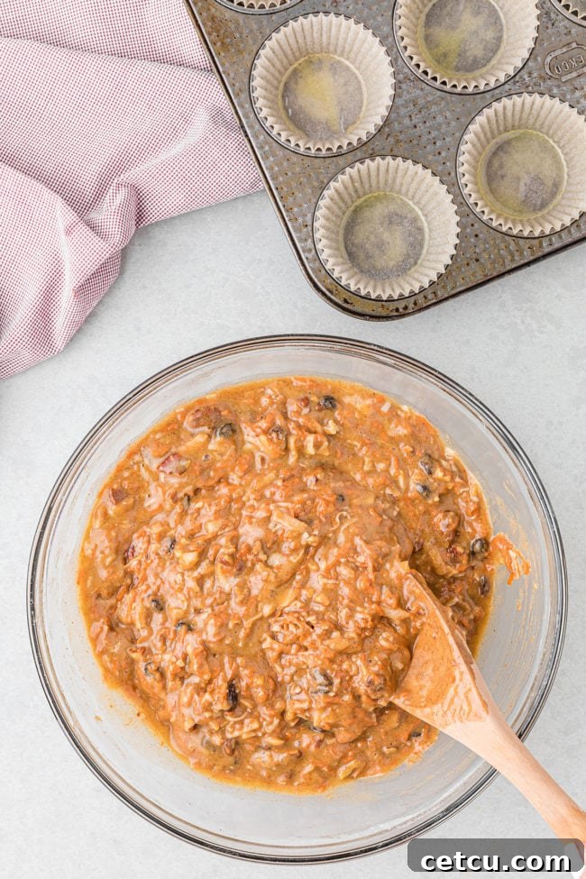 morning glory muffin batter in a glass bowl