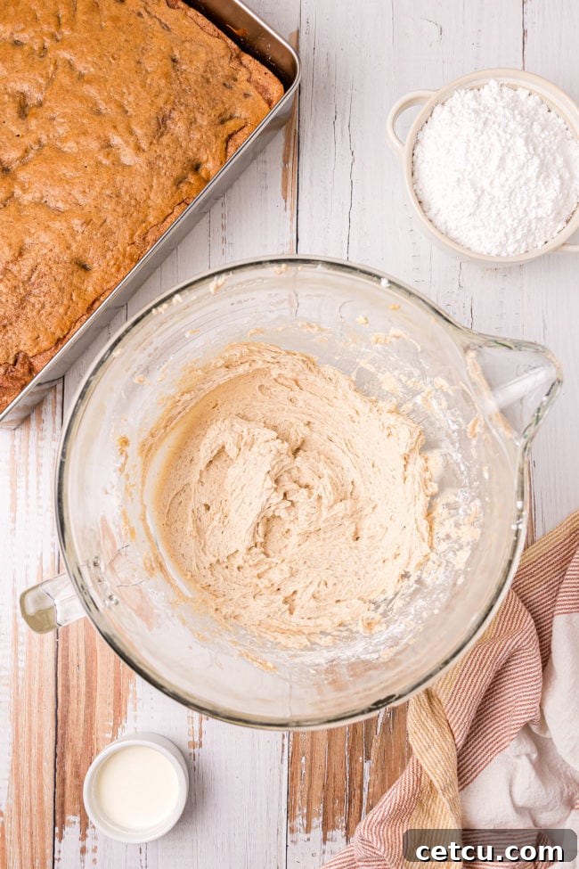 cinnamon frosting in a glass mixing bowl