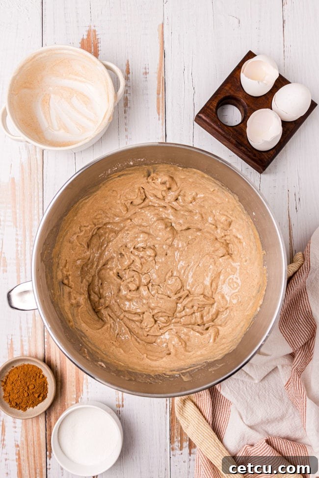 cake batter in electric mixer bowl