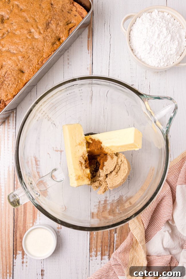 butter and sugar in glass mixing bowl