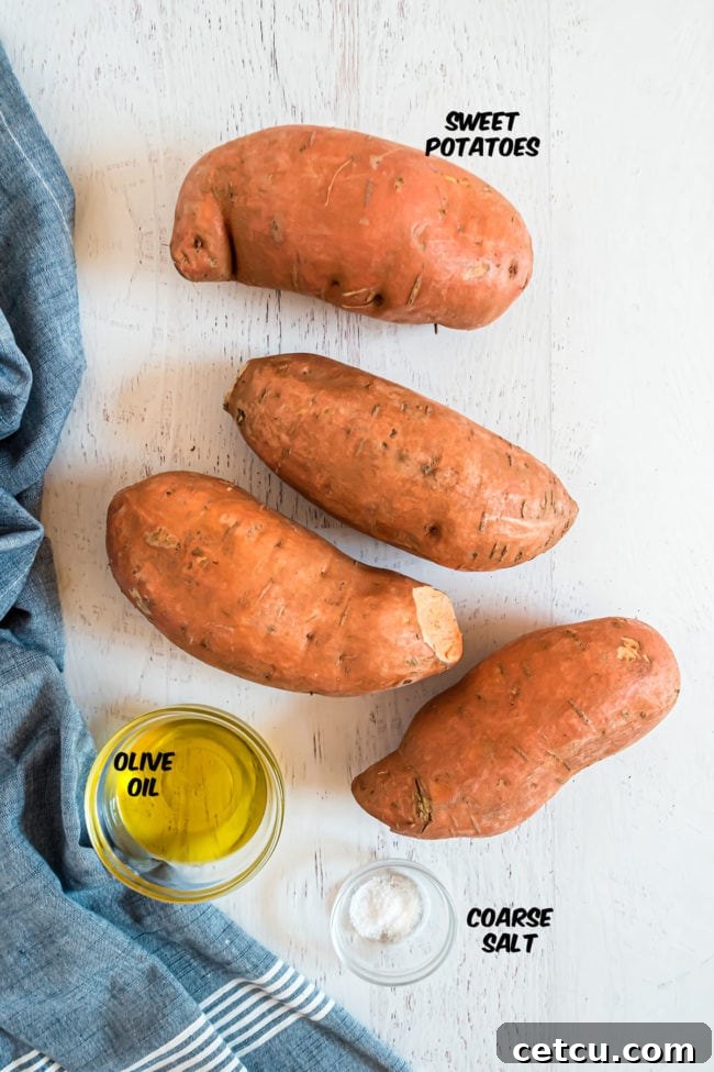 sweet potatoes with a bowl of oil and bowl of salt on a counter with a blue towel