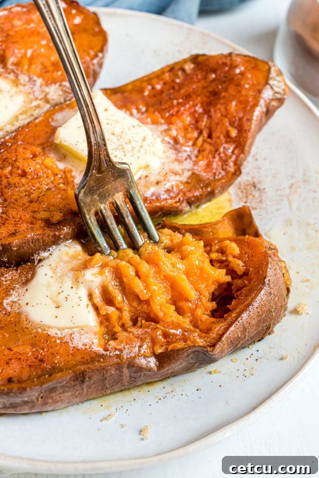 tender baked sweet potatoes with a fork