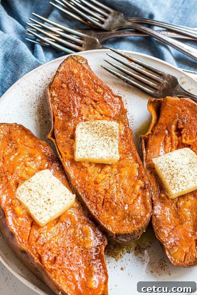 three quick baked sweet potatoes with a pat of butter and sprinkle of cinnamon