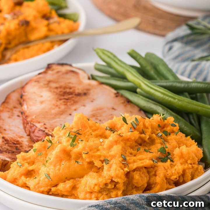 plated mashed sweet potatoes with green beans and ham