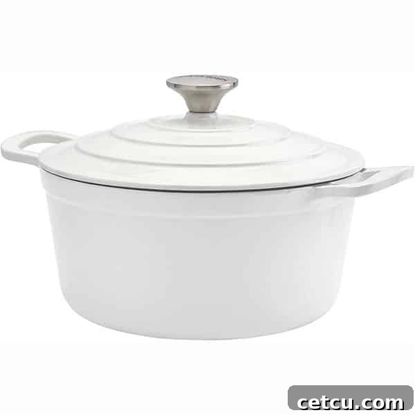 A pristine white Dutch oven, perfect for slow simmering chili or stews.