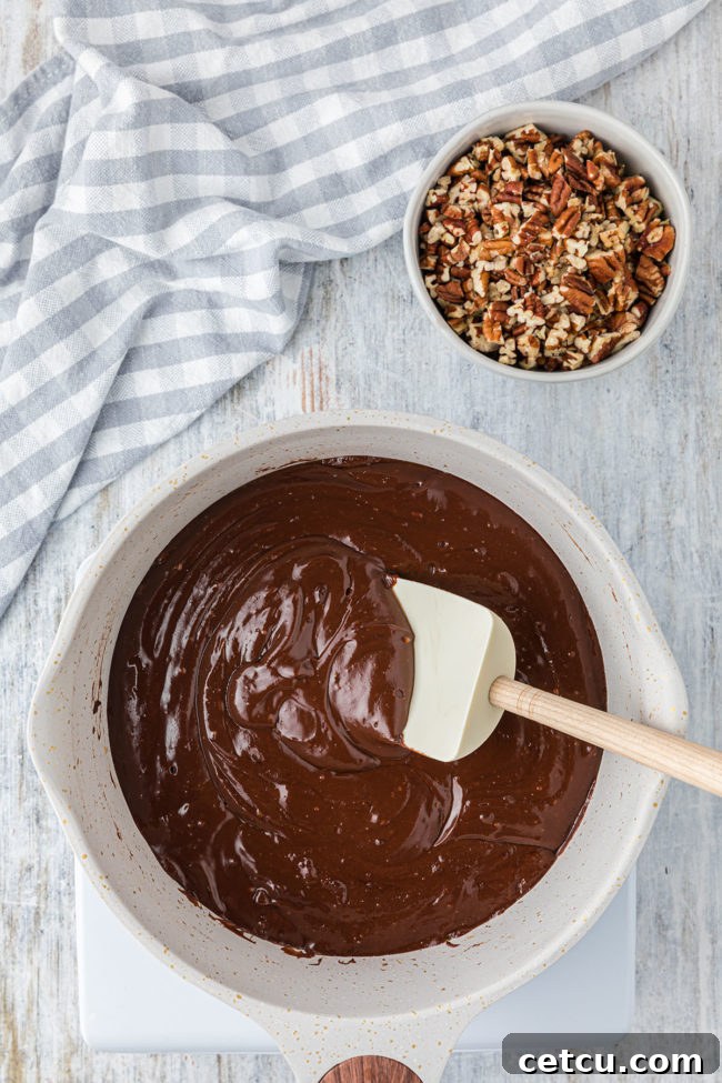 Step 2: Combining chocolate, cream cheese, and milk for fudge