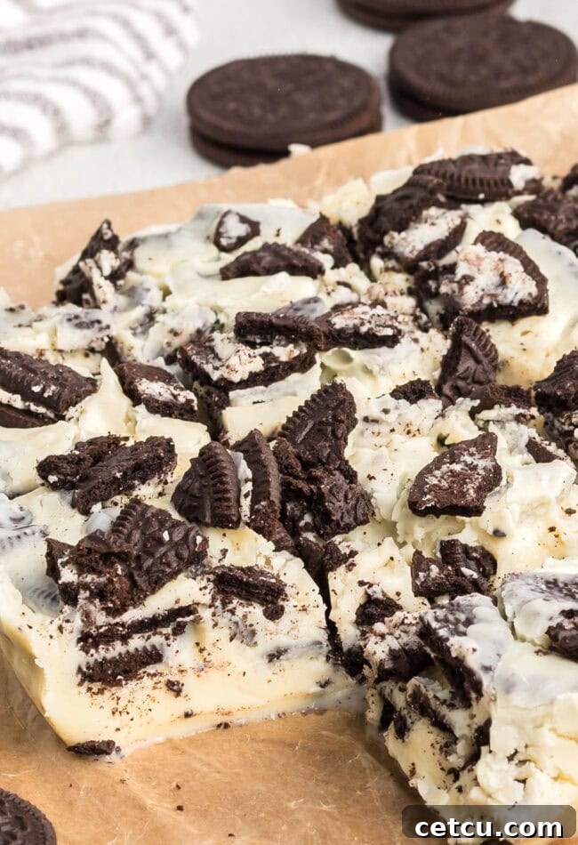 Oreo fudge cut into servings on a white plate