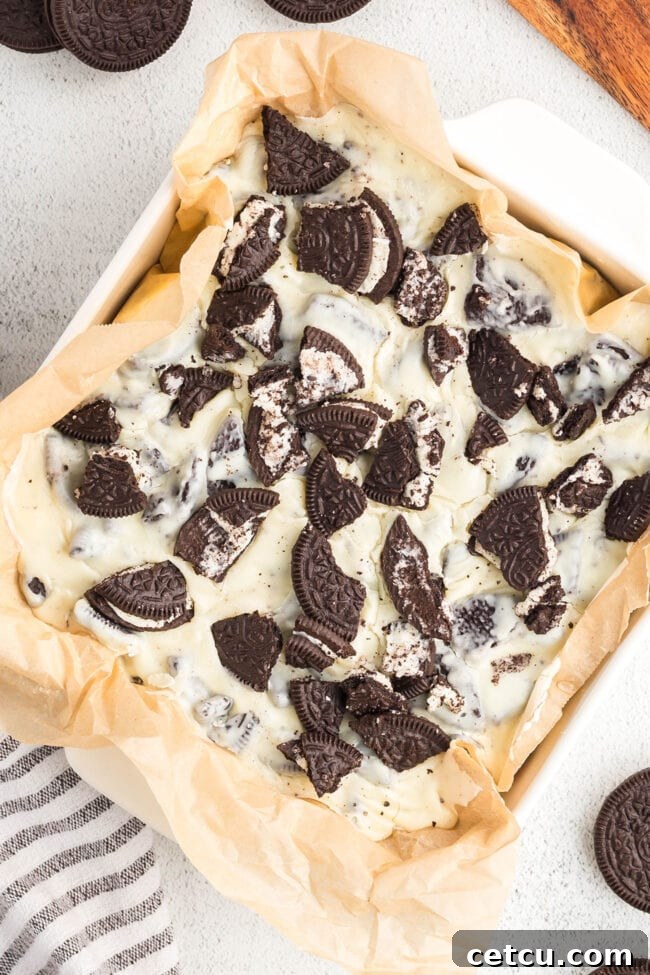 Oreo cookie fudge topped with crushed Oreos in a baking dish