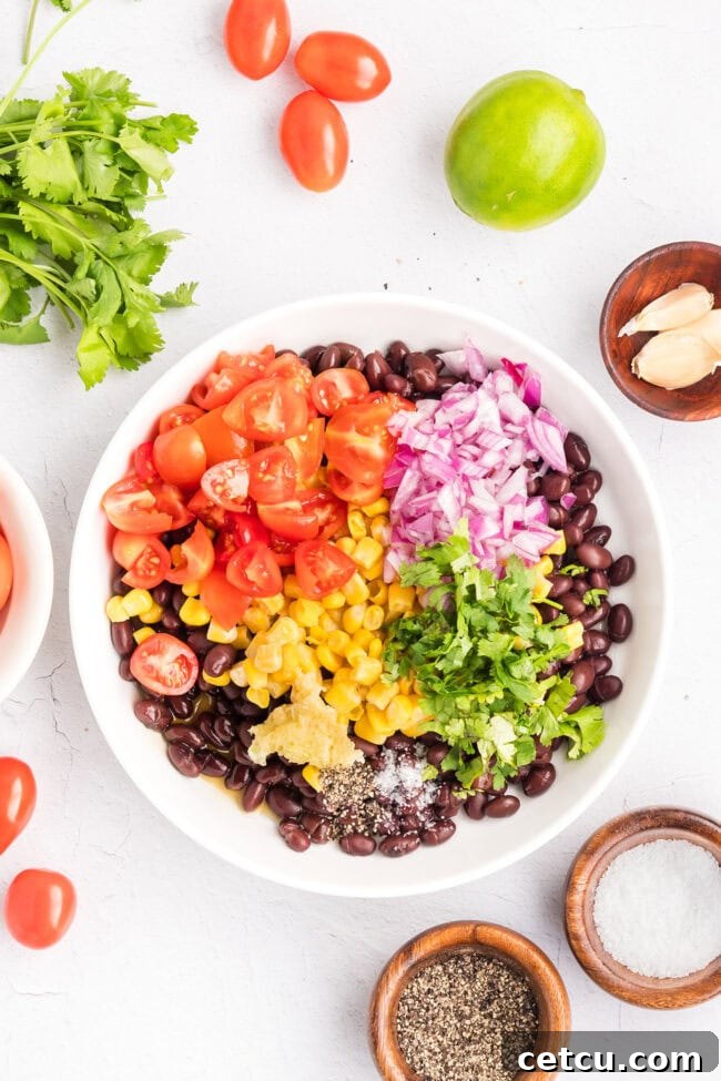 Southwest Steak Bowl Recipe: Creamy Southwest Sauce 6 Combining black beans, corn, tomatoes, red onion, cilantro, and lime juice to make the Southwest salad.