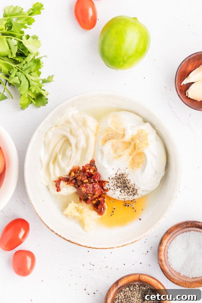 Southwest Steak Bowl Recipe: Creamy Southwest Sauce 7 Mixing sour cream, mayonnaise, chipotle peppers, garlic, lime juice, honey, and seasonings to make creamy Southwest sauce.