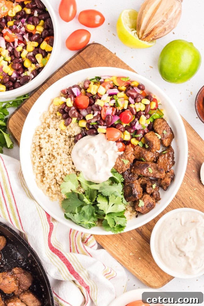 Southwest Steak Bowl Recipe: Creamy Southwest Sauce 9 Finished Southwest steak bowl with seasoned sirloin steak, rice, black bean and corn salad, fresh cilantro, and creamy Southwest sauce.